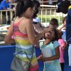 Seven-year-old Hana Stewart gets a helping hand with cotton candy from mom Hirimi.